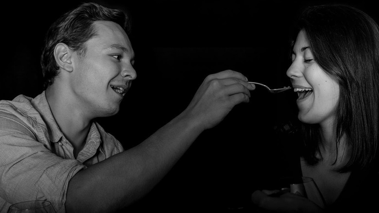 Couple eating dinner in darkness