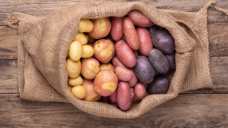 different colored potatoes in sack