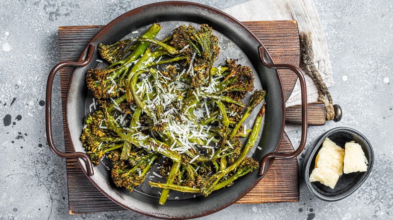 grilled broccolini in a cast iron pan