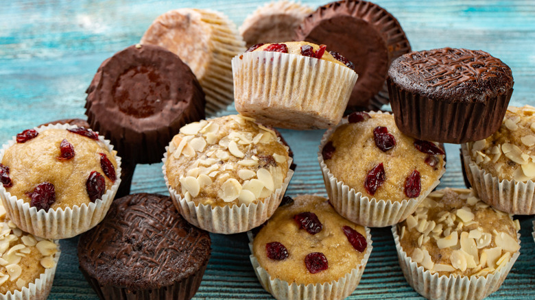 a pile of assorted muffins