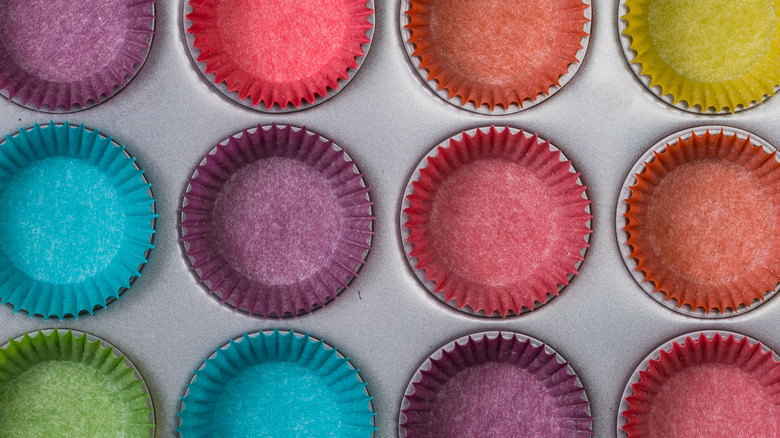 assortment of colorful muffin cases in tray