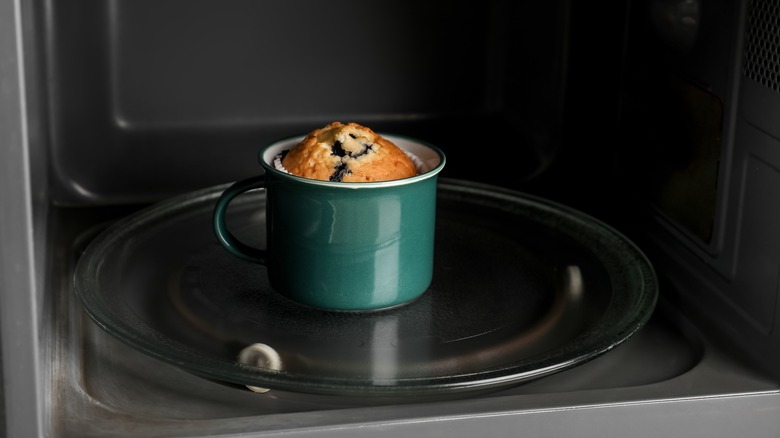 muffin in ceramic mug in microwave