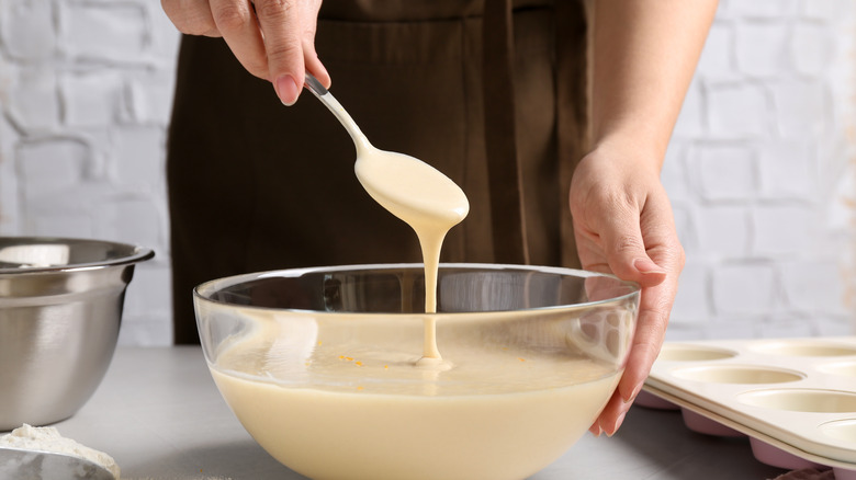 a spoon dripping batter into bowl