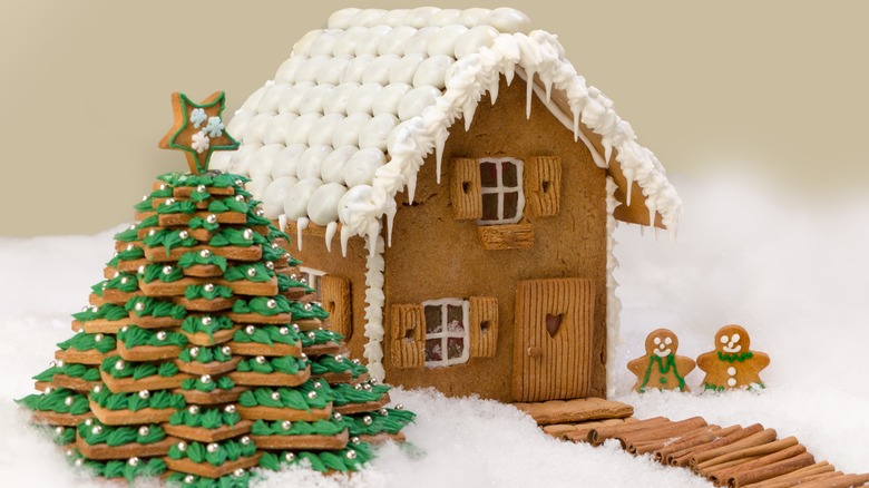 gingerbread house surrounded by fake snow