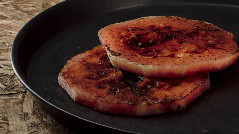 Two slices of fried watermelon on plate