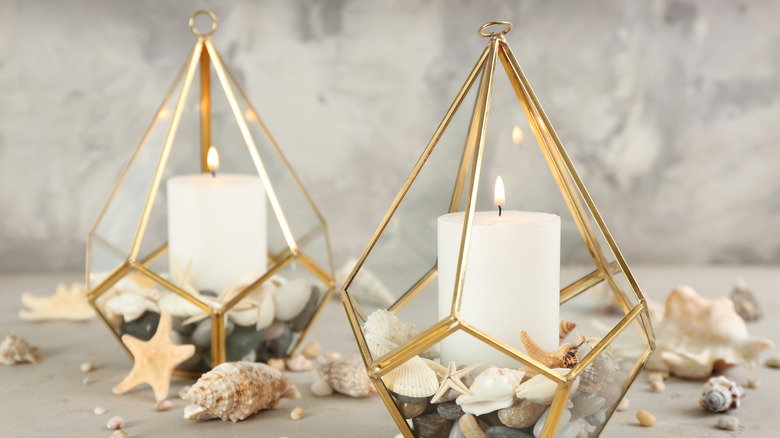 two candles and sea shells