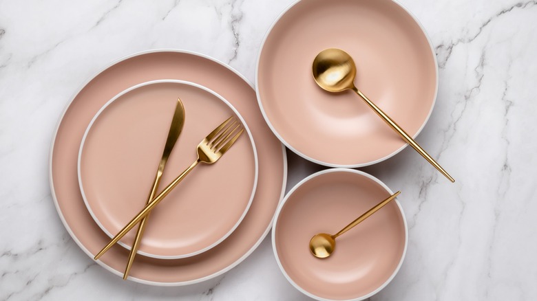 rose plates with gold cutlery