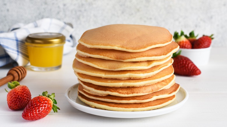 stack of pancakes with strawberries