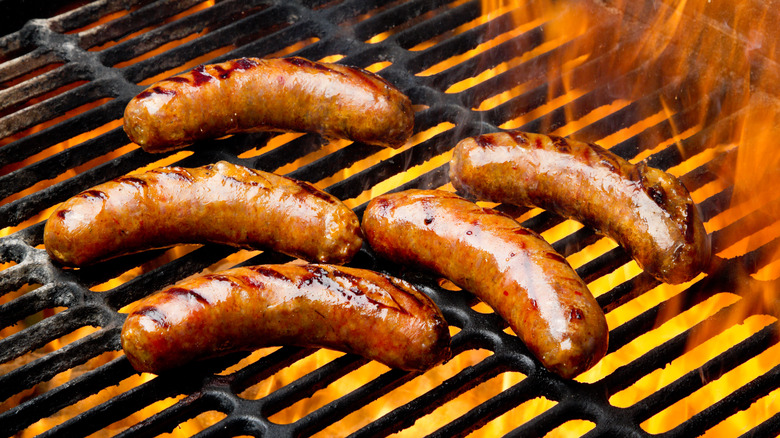 sausage links cooking on grill