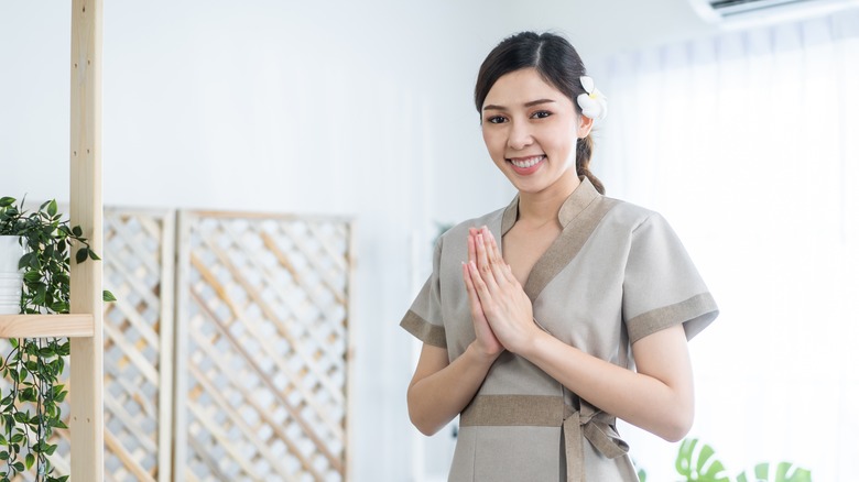 thai lady with hands together