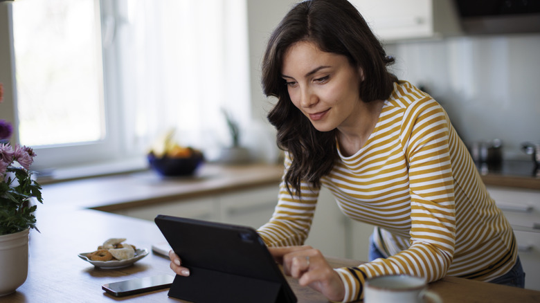 a woman using a tablet