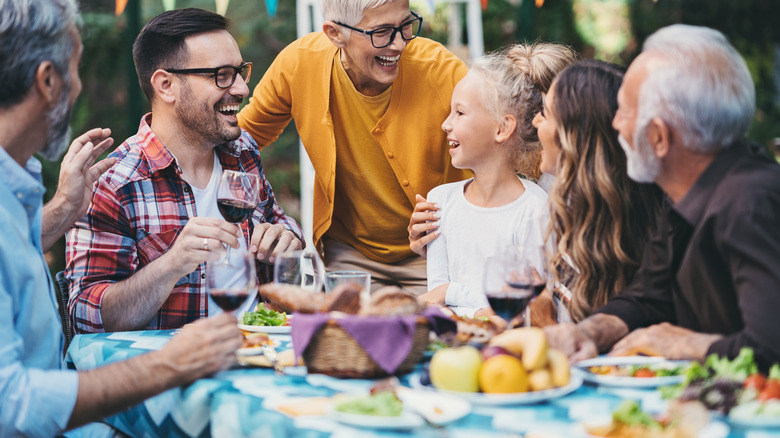 guests laughing over a meal