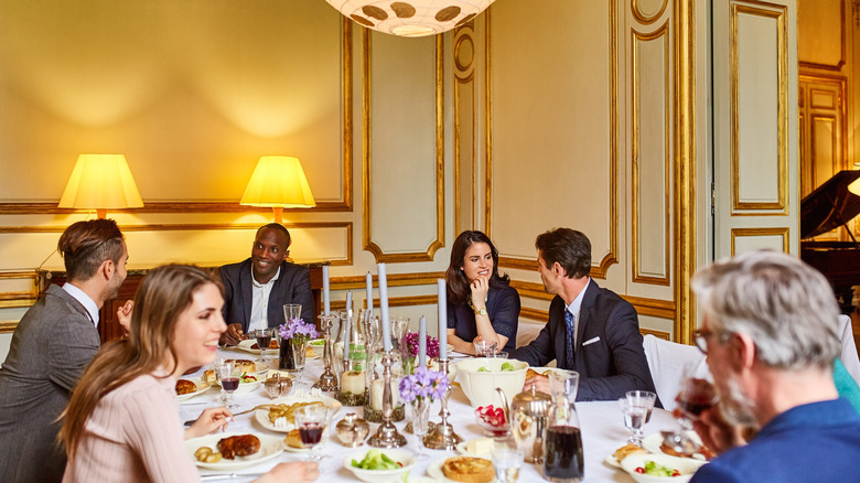 friends seated at a dinner table