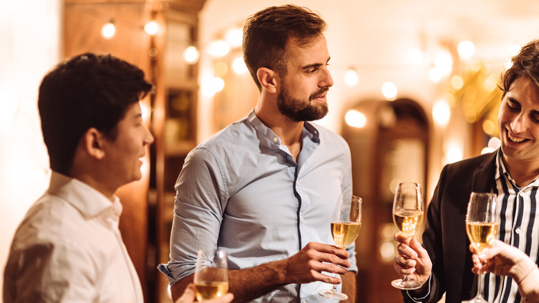 friends holding wine glasses