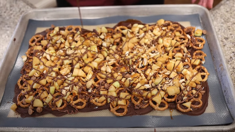 Caramel apple bark with melted chocolate and pretzels