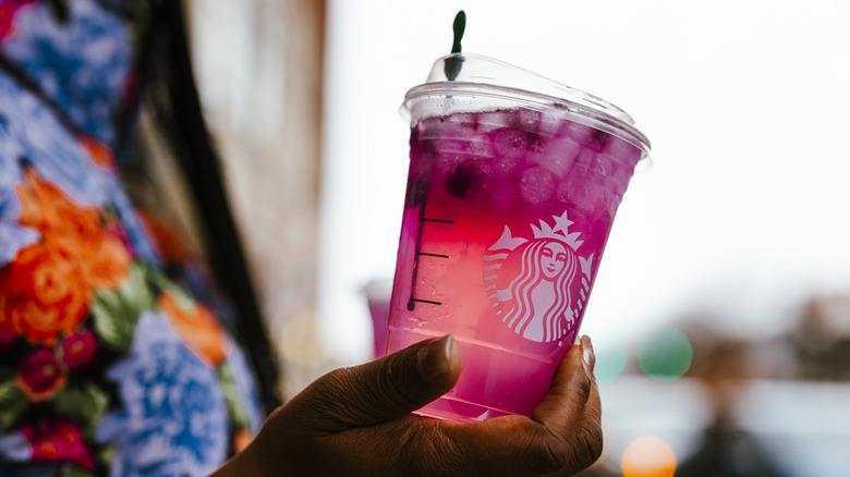 Starbucks iced pink fruit drink in plastic cup