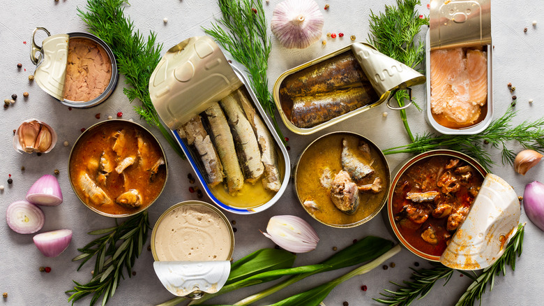 Open cans of different types of fish