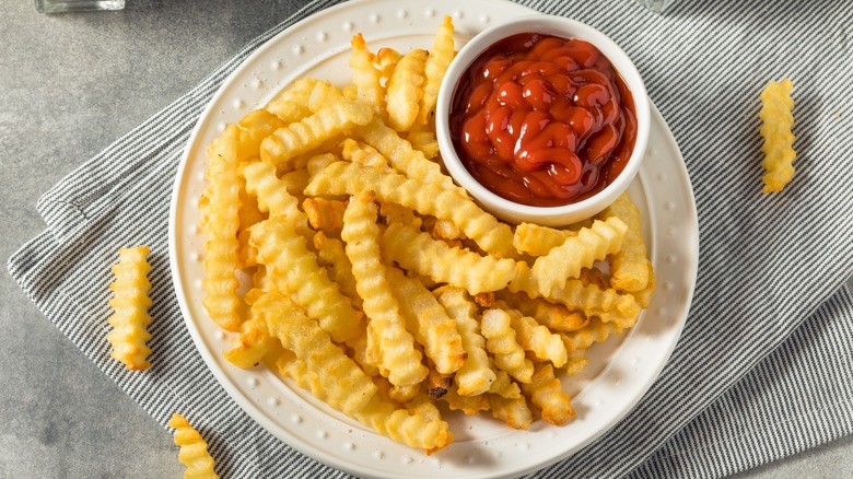 Crinkle-cut fries with ketchup
