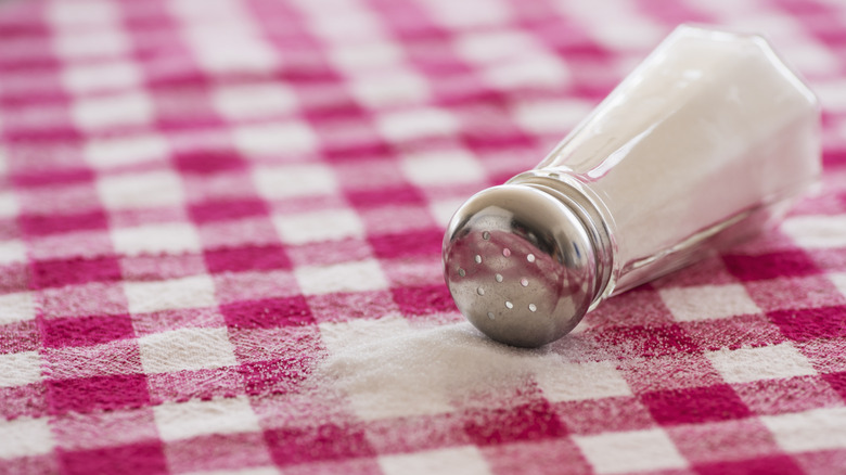 iodized table salt spilled on tablecloth