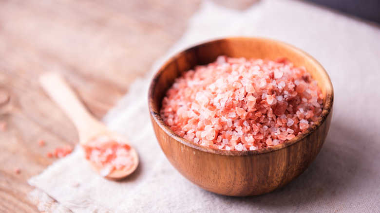 bowl and spoon of coarse Himalayan pink salt