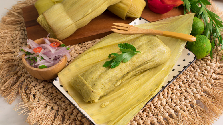 Tamales with onions and limes