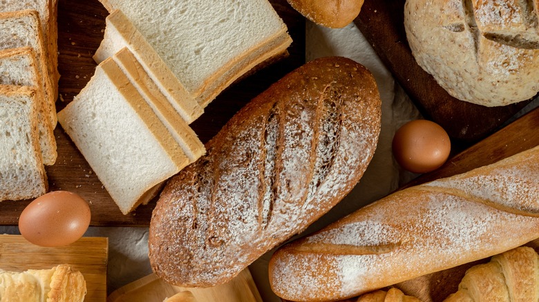 variety of breads on wooden board