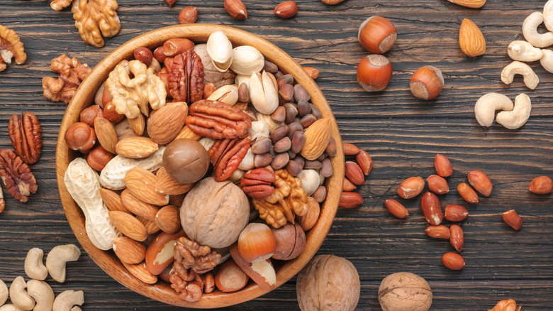 mixed nuts in wooden bowl