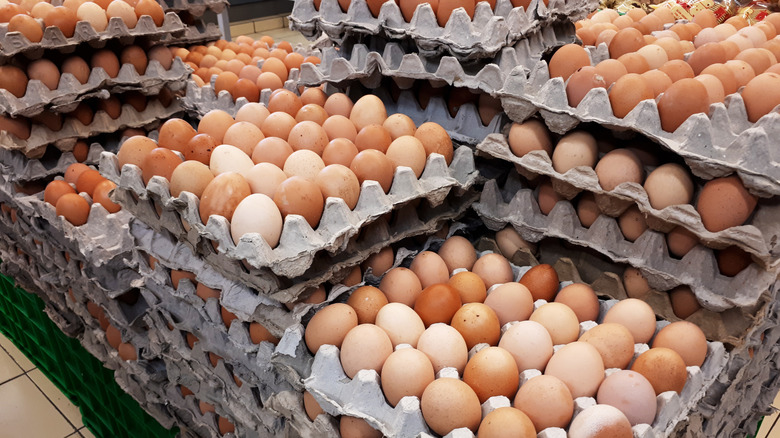 Eggs are stacked in pallets.