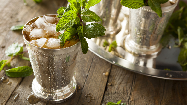 mint julep served on detailed metal cup