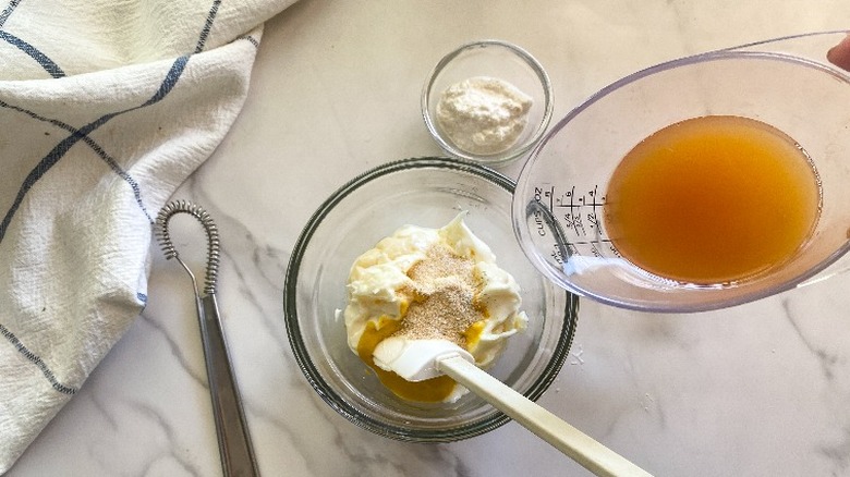 combining ingredients in glass bowl