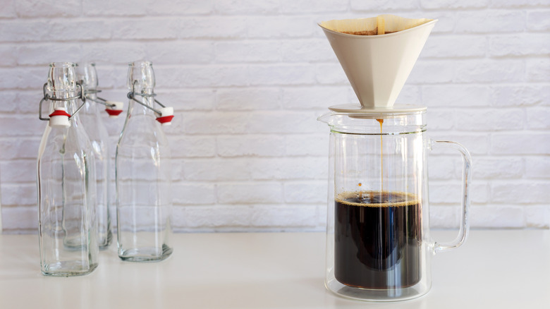 A jug of cold brew with a coffee filter