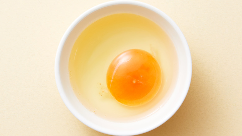 raw egg in ramekin