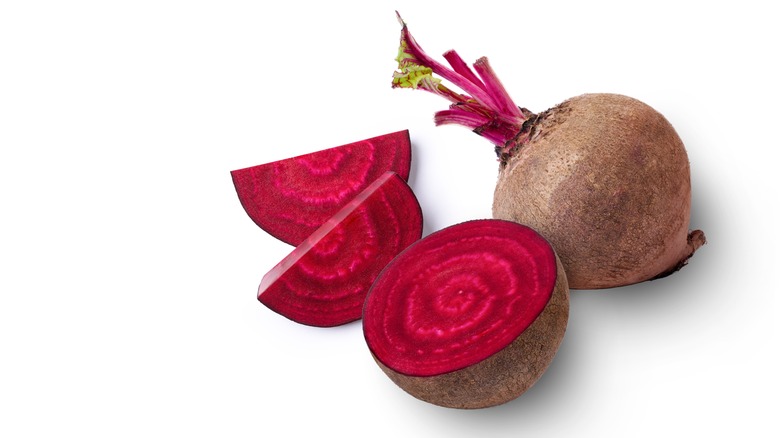 whole beet and a beet cut open