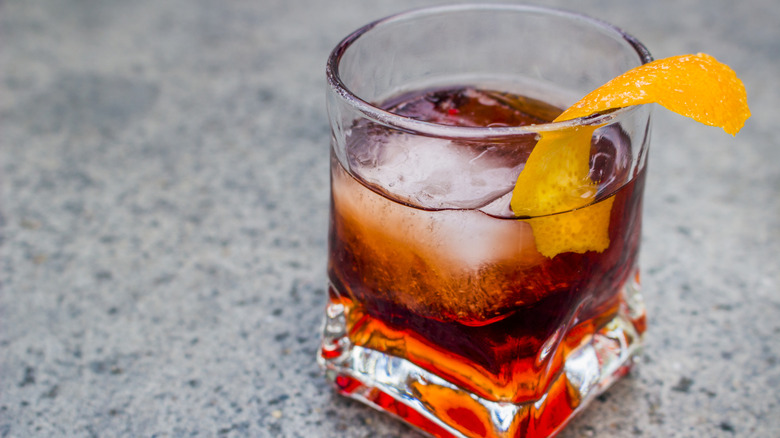 A Negroni garnished with a sliver of orange peel