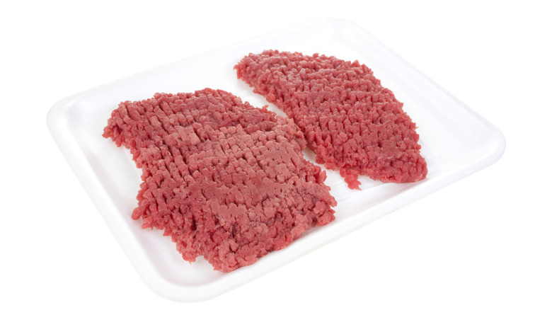 cube steaks on white background