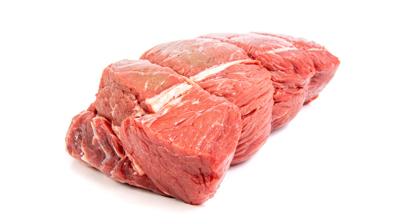 sirloin tip steak on white background