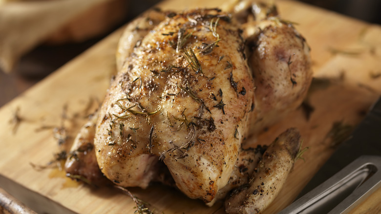 roast chicken on cutting board