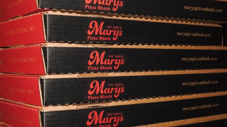 Stack of Mary's Pizza Shack pizza boxes