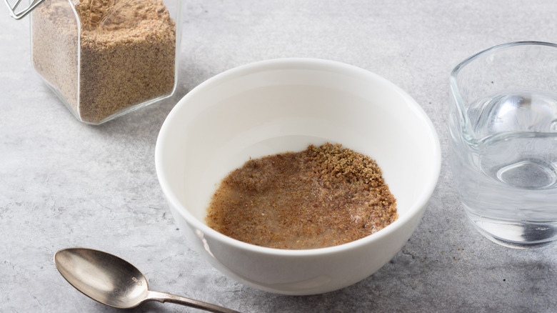 bowl of ground flaxseed and water making a flax egg