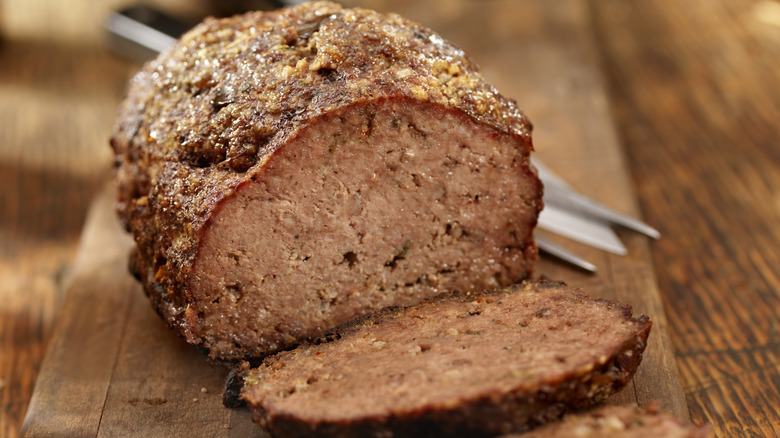 cooked meatloaf with slices and glaze