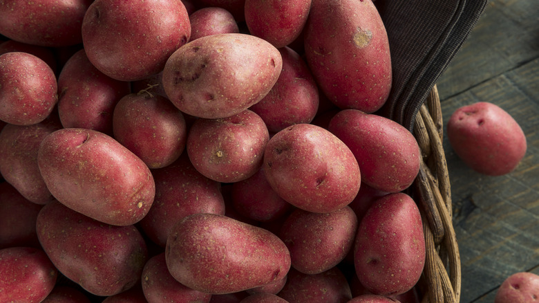 overflowing basket of red potatoes