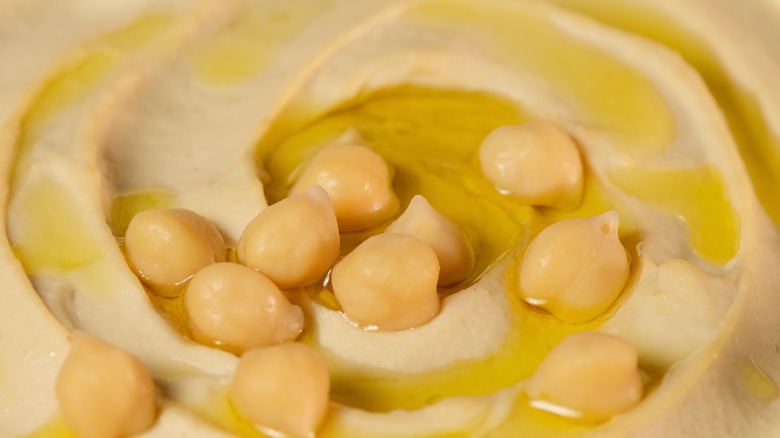 close-up of hummus topped with chickpeas