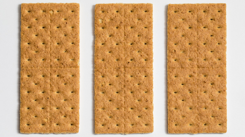 Three whole graham crackers white background