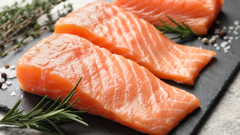 raw salmon fillets with herbs