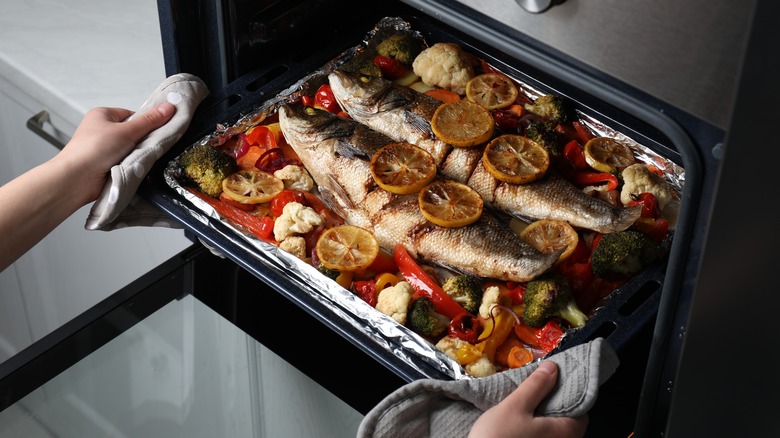 baked sea bass going into oven