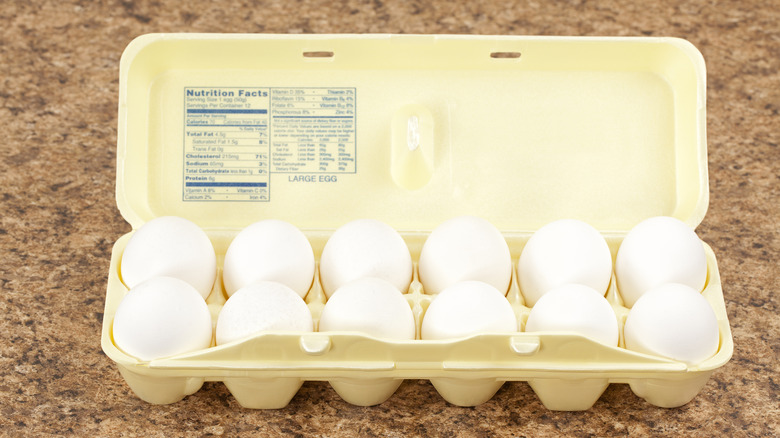 Open carton of eggs