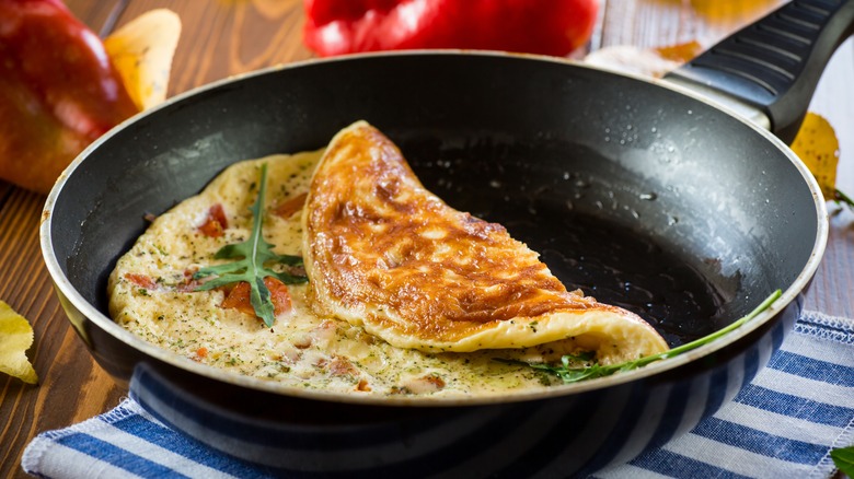 omelet in black frying pan