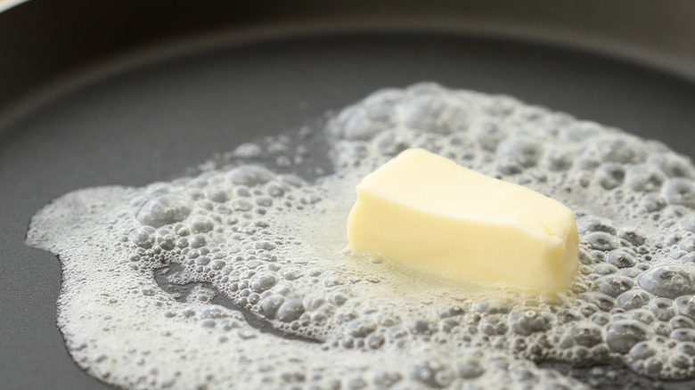 butter melting in frying pan