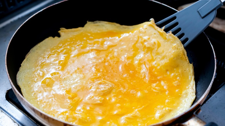 omelet cooking in pan