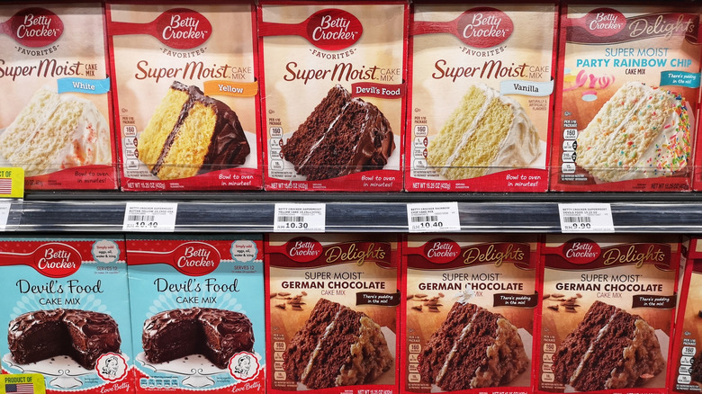 Aisle full of boxed cake mix at grocery store